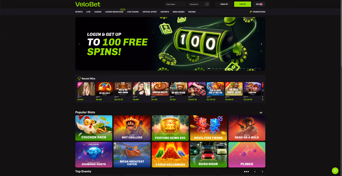 VeloBet homepage showing the login and get up to 100 free spins offer, a recent wins ticker and popular slots